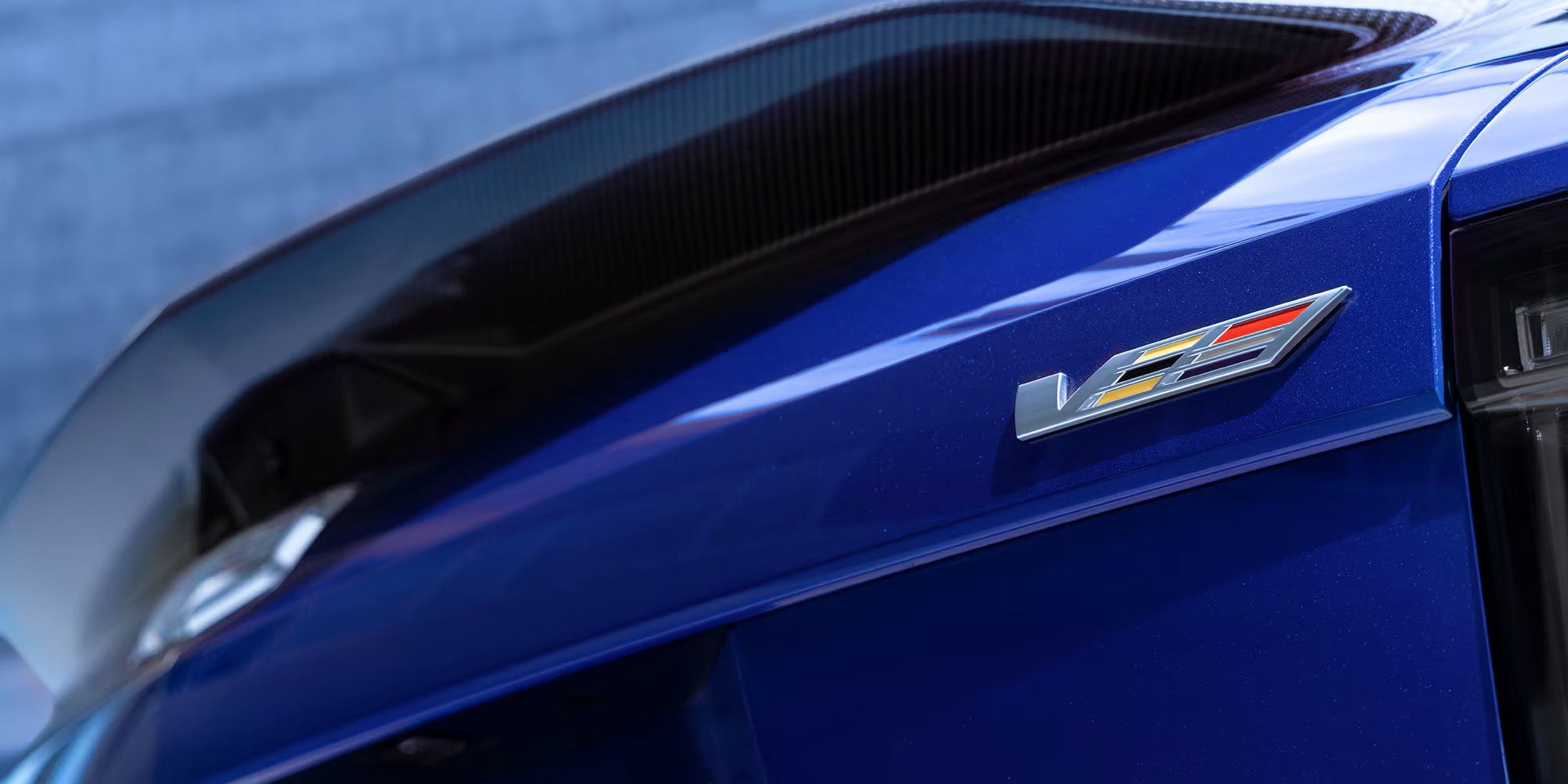 Rear spoiler and V-Series badge on a 2027 Cadillac OPTIQ-V