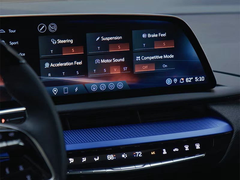V-Mode button on the steering wheel of a 2027 Cadillac OPTIQ-V